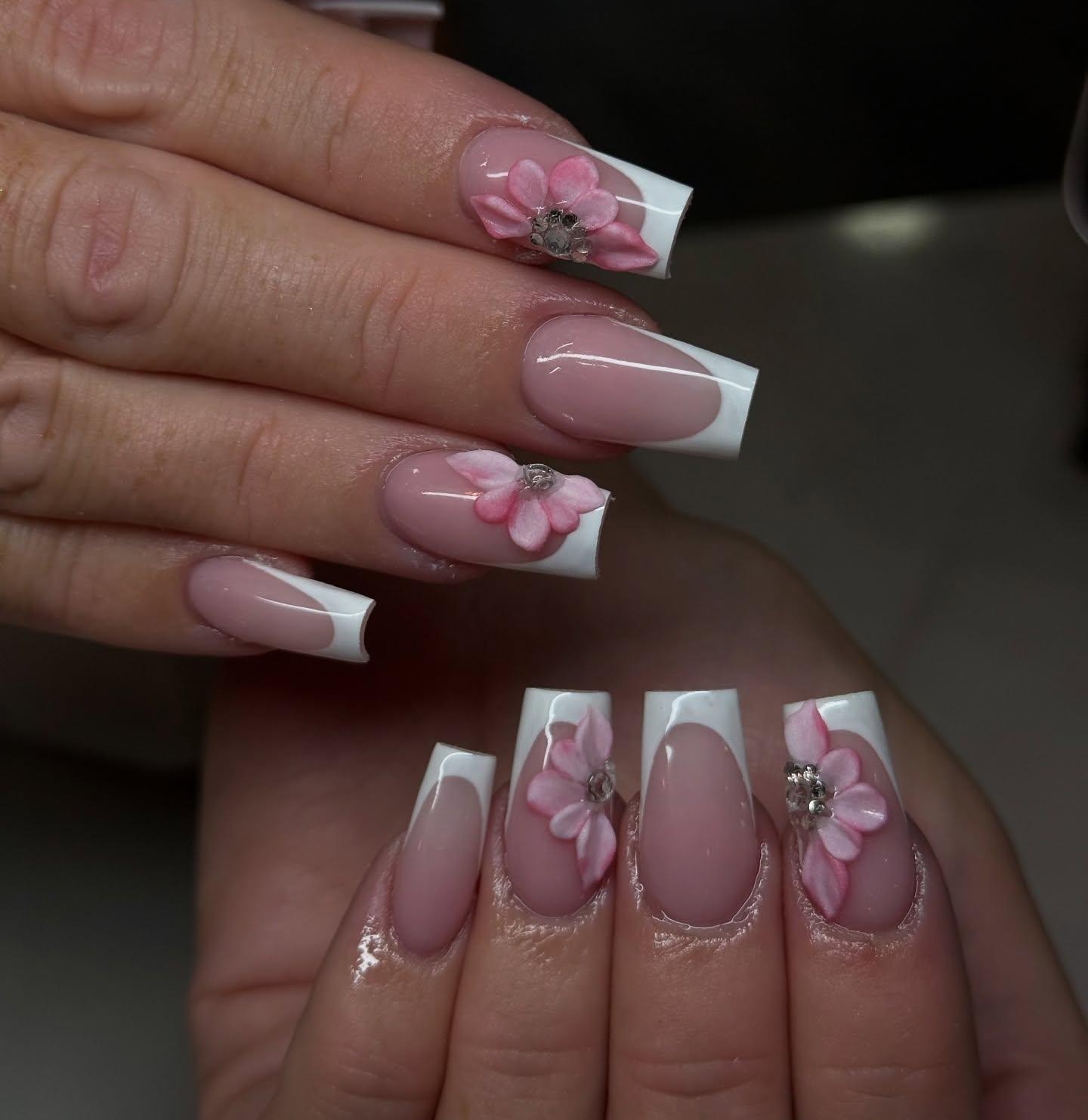 Acrylic French tip nails with 3D pink flower nail art at Nel's Nails Portsmouth